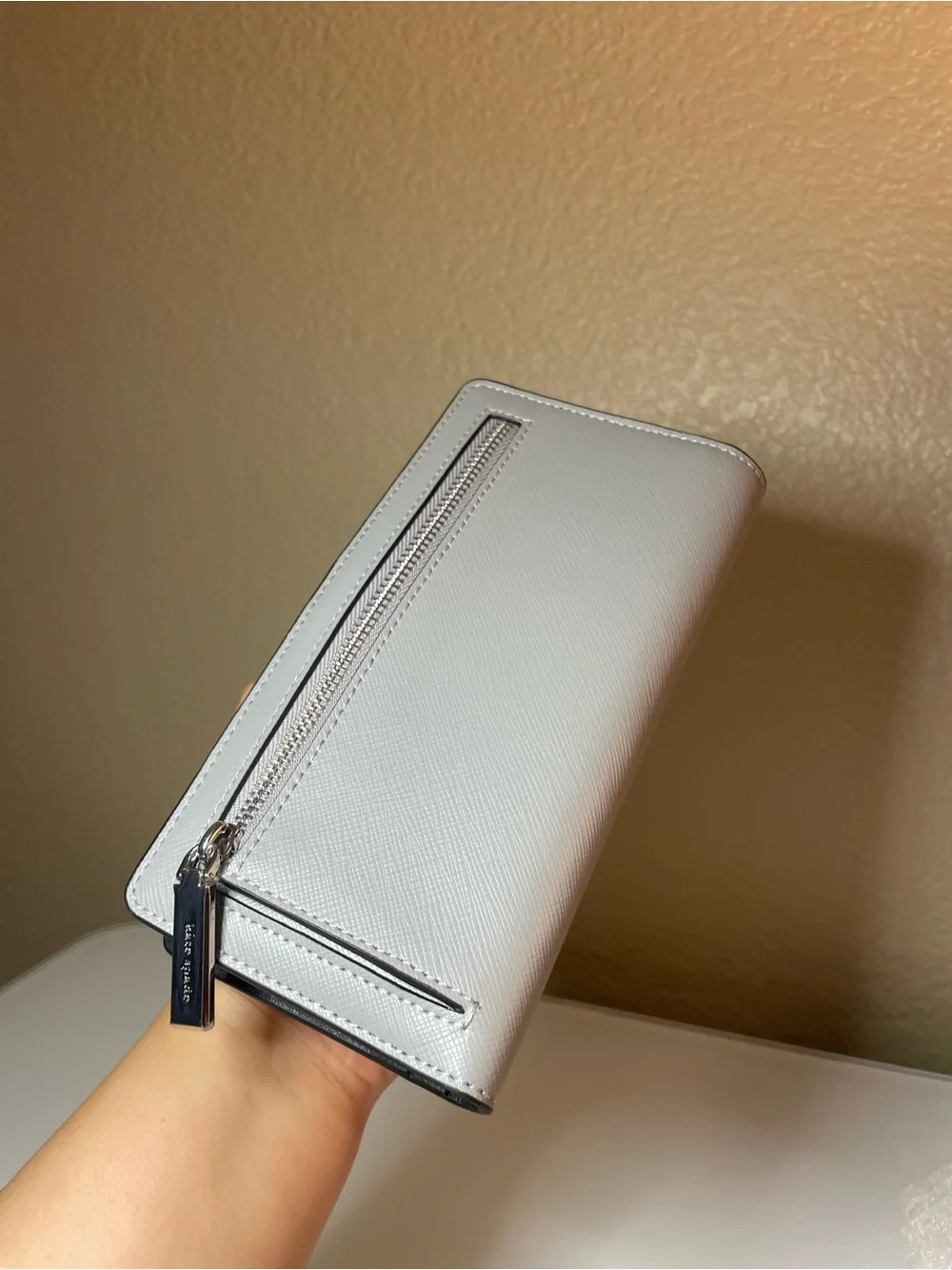 kate spade Two-Tone White and Light Gray Saffiano Zip Wallet with Gold Logo